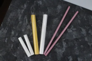 Assorted colored zirconia ceramic rods with smooth surfaces, used for high-durability industrial and medical applications.