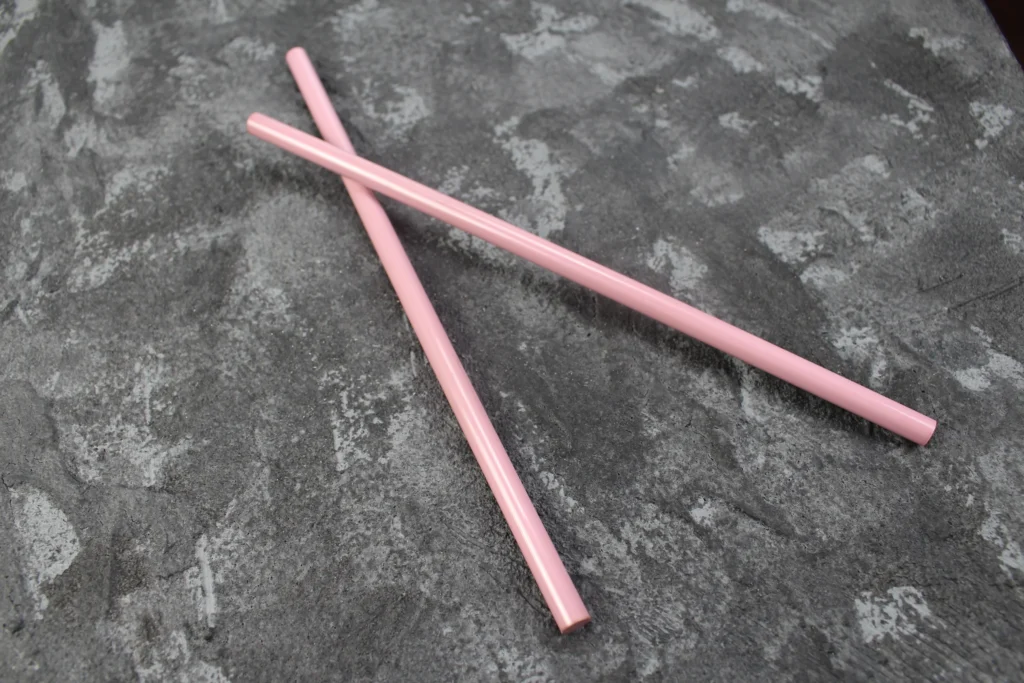Assorted colored zirconia ceramic rods with smooth surfaces, used for high-durability industrial and medical applications.