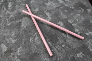 Assorted colored zirconia ceramic rods with smooth surfaces, used for high-durability industrial and medical applications.